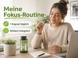 Eine Frau am Schreibtisch nutzt Rhodiola Rosea für ihre tägliche Fokus-Routine.